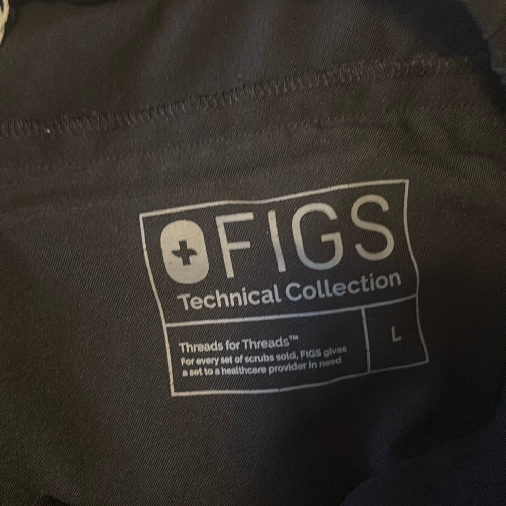 FIGs black pants stretch waist small slit at ankle and zippered back pockets